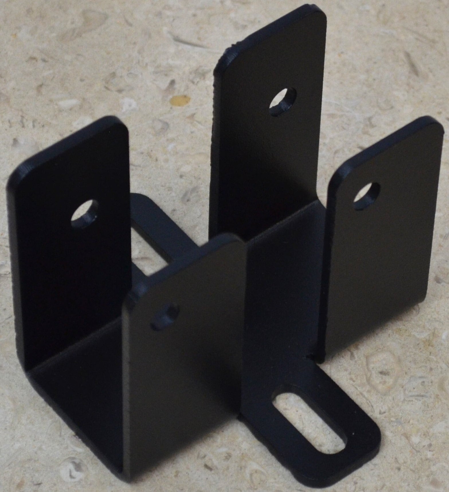 The black metal bracket features multiple holes for easy attachment and stability, making it ideal for construction, renovations, and DIY activities.