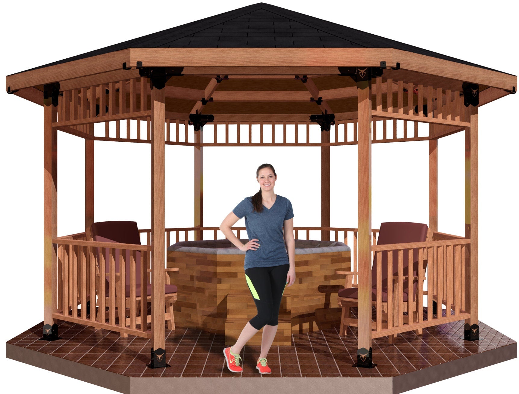 A woman stands inside a spacious wooden gazebo, giving a thumbs up while surrounded by cozy chairs and a hot tubl. It’s a beautiful day outdoors.